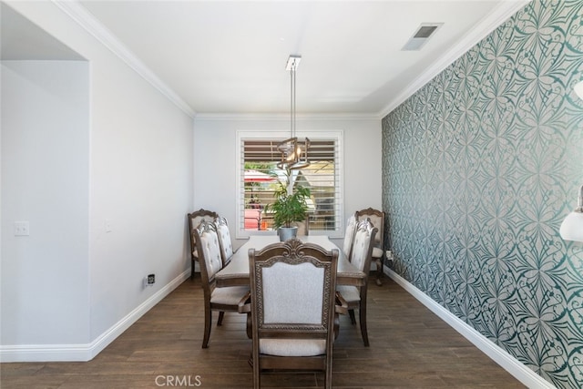 3720 Gunnison Cir, Corona, CA 92881 - dining space featuring crown molding, wallpapered walls, dark wood-style flooring, an accent wall, and a chandelier