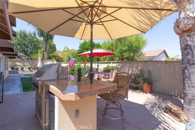 3720 Gunnison Cir, Corona, CA 92881 - fenced backyard with area for grilling, a patio, and beverage cooler