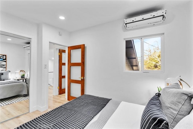 501 Solway St, Glendale, CA 91206 - bedroom featuring a wall mounted AC, light wood-style floors, and recessed lighting