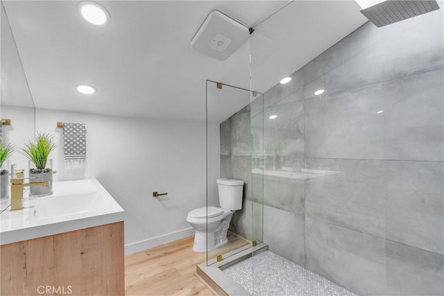 501 Solway St, Glendale, CA 91206 - full bathroom featuring tiled shower, vanity, wood finished floors, and recessed lighting