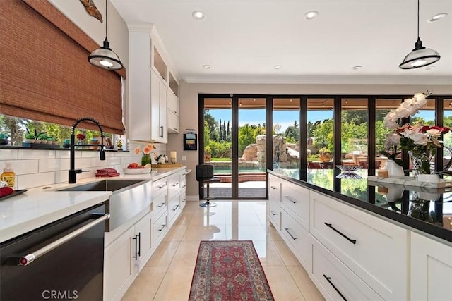 2335 N San Antonio Ave, Upland, CA 91784 - kitchen featuring black dishwasher, plenty of natural light, decorative light fixtures, tasteful backsplash, and ornamental molding