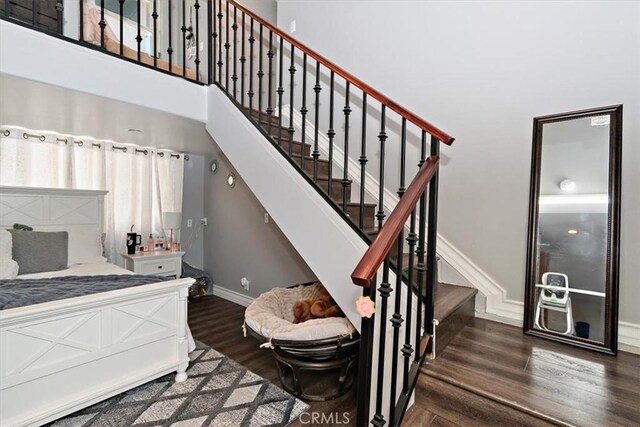 2335 N San Antonio Ave, Upland, CA 91784 - stairway featuring wood finished floors and a towering ceiling