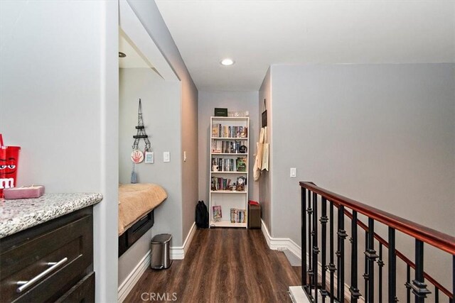 2335 N San Antonio Ave, Upland, CA 91784 - hallway with dark wood-type flooring, recessed lighting, and an upstairs landing