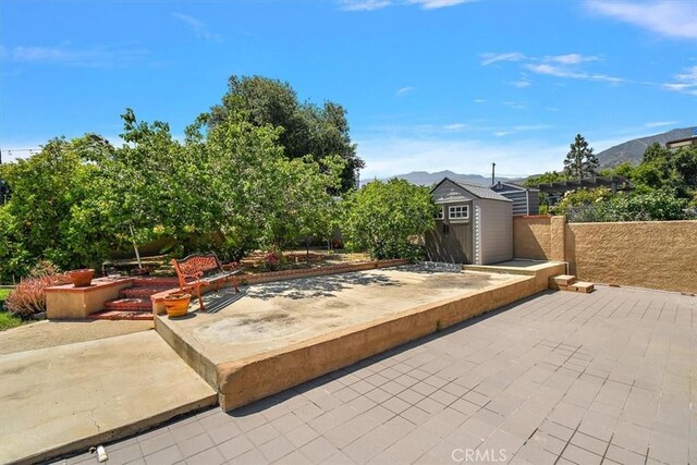 2335 N San Antonio Ave, Upland, CA 91784 - view of patio with a storage unit and a mountain view