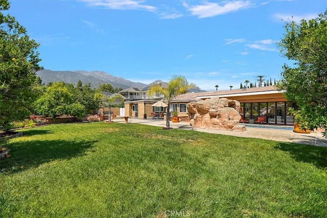 2335 N San Antonio Ave, Upland, CA 91784 - rear view of property with a patio area, stone siding, a yard, and a mountain view