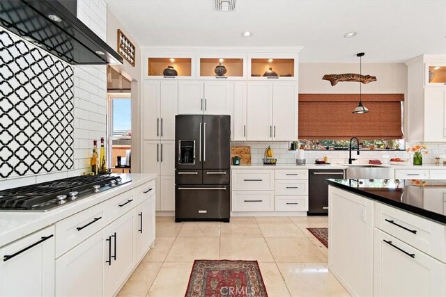 2335 N San Antonio Ave, Upland, CA 91784 - kitchen featuring refrigerator with ice dispenser, dishwashing machine, wall chimney exhaust hood, stainless steel gas stovetop, and decorative backsplash