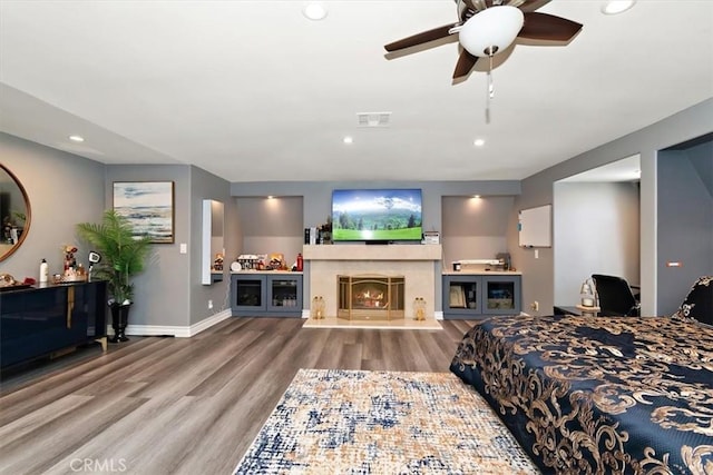 2335 N San Antonio Ave, Upland, CA 91784 - bedroom featuring wood finished floors, a premium fireplace, and recessed lighting