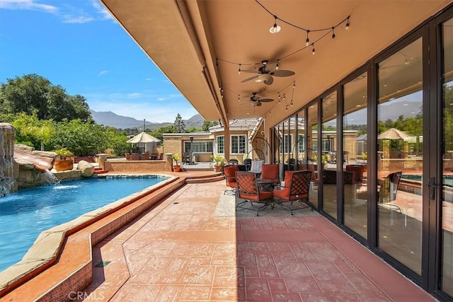 2335 N San Antonio Ave, Upland, CA 91784 - view of patio with a mountain view, a ceiling fan, and an outdoor pool