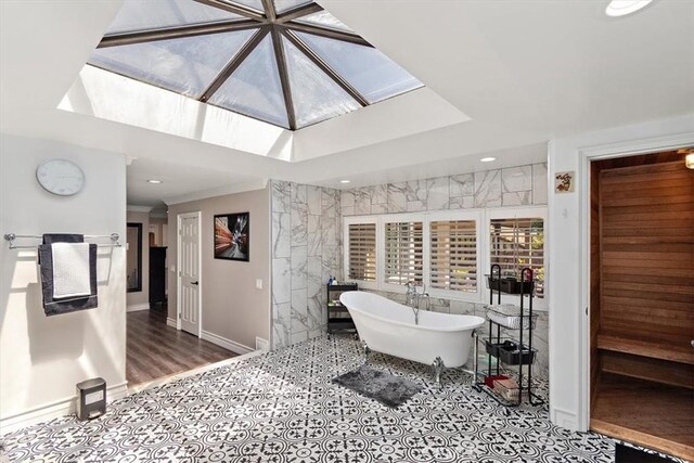 2335 N San Antonio Ave, Upland, CA 91784 - full bath with a freestanding tub, a skylight, and tile walls