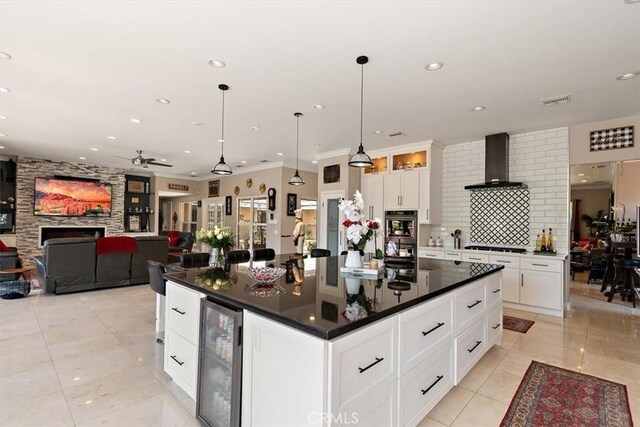 2335 N San Antonio Ave, Upland, CA 91784 - kitchen with beverage cooler, a ceiling fan, wall chimney range hood, dark countertops, and light tile patterned floors