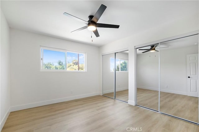 801 Navajo Dr, Riverside, CA 92507 - unfurnished bedroom featuring multiple closets, light wood-type flooring, and a ceiling fan