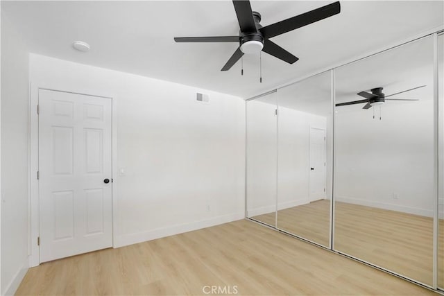 801 Navajo Dr, Riverside, CA 92507 - unfurnished bedroom with light wood-type flooring, a ceiling fan, and a closet