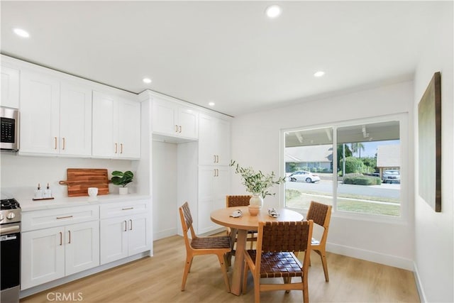 801 Navajo Dr, Riverside, CA 92507 - dining area featuring light wood-style floors and recessed lighting