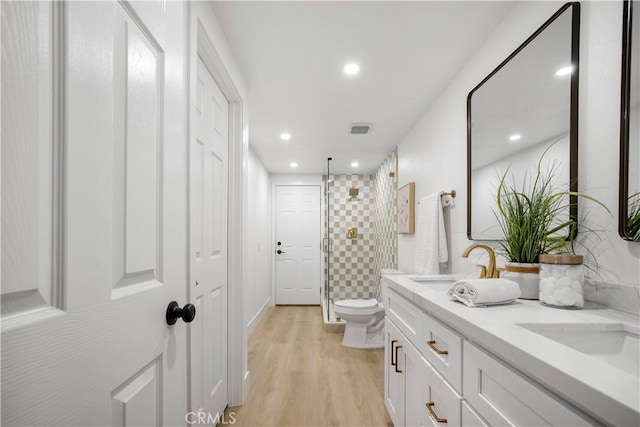 801 Navajo Dr, Riverside, CA 92507 - full bath featuring a stall shower, double vanity, wood finished floors, and recessed lighting