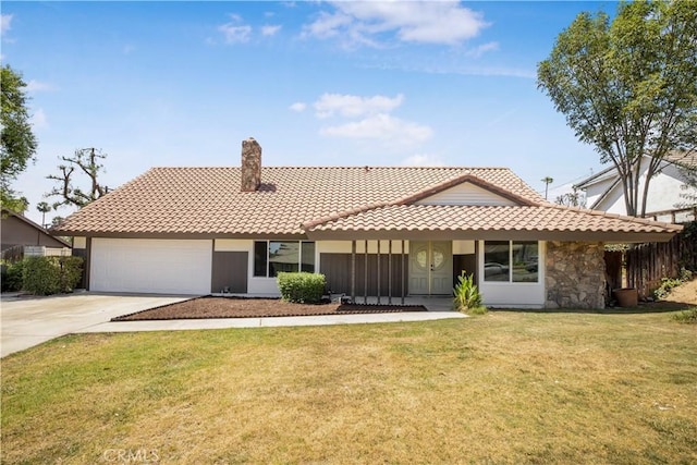 801 Navajo Dr, Riverside, CA 92507 - view of front of house with a tiled roof, concrete driveway, a chimney, a front yard, and a garage