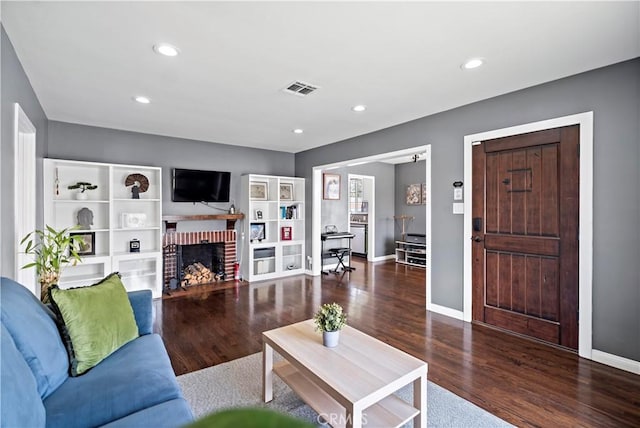 1425 Violeta Dr, Alhambra, CA 91801 - living area with wood finished floors, a brick fireplace, and recessed lighting