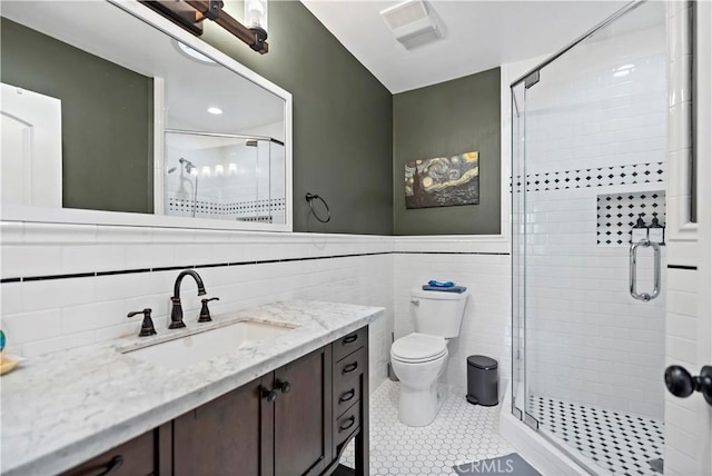 1425 Violeta Dr, Alhambra, CA 91801 - bathroom with a shower stall, vanity, tile walls, tile patterned flooring, and a wainscoted wall