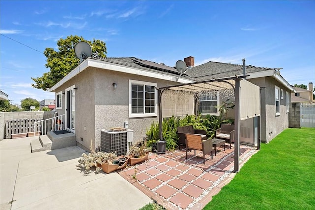 1425 Violeta Dr, Alhambra, CA 91801 - back of house with a patio area, stucco siding, a fenced backyard, and roof mounted solar panels
