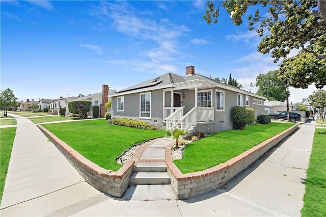 1425 Violeta Dr, Alhambra, CA 91801 - view of front facade featuring solar panels, stucco siding, a front lawn, and a chimney