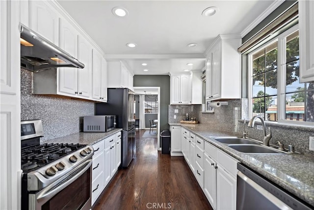 1425 Violeta Dr, Alhambra, CA 91801 - kitchen with stainless steel appliances, under cabinet range hood, white cabinetry, tasteful backsplash, and recessed lighting