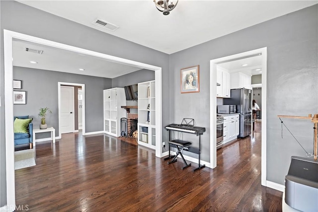 1425 Violeta Dr, Alhambra, CA 91801 - living area featuring a brick fireplace and wood finished floors