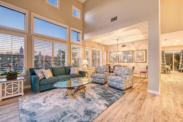 5 Kennedy Ct, Coto De Caza, CA 92679 - living room featuring a chandelier, wood finished floors, and a towering ceiling