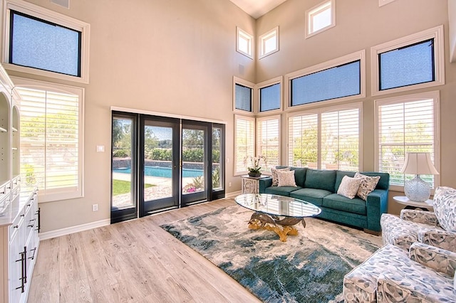 5 Kennedy Ct, Coto De Caza, CA 92679 - living area with a towering ceiling and light wood-style flooring