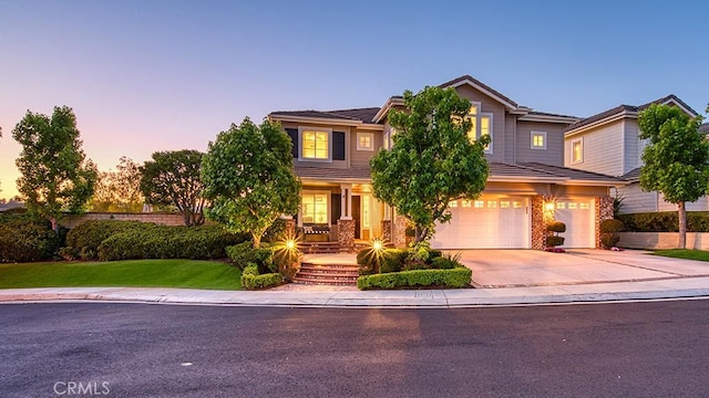 5 Kennedy Ct, Coto De Caza, CA 92679 - view of front of home with a garage, concrete driveway, covered porch, brick siding, and a lawn