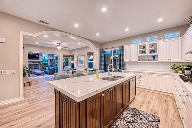 5 Kennedy Ct, Coto De Caza, CA 92679 - kitchen with an island with sink, appliances with stainless steel finishes, ceiling fan, light wood-type flooring, and white cabinetry