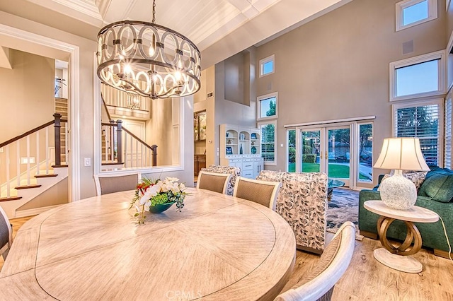 5 Kennedy Ct, Coto De Caza, CA 92679 - dining space with stairway, a chandelier, a towering ceiling, and wood finished floors