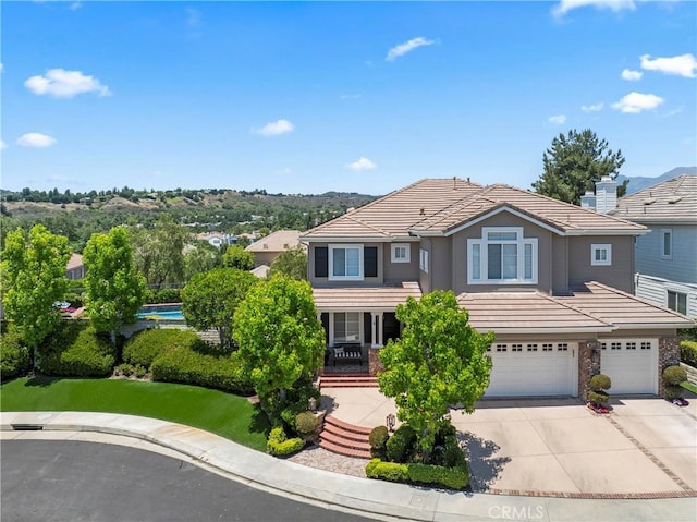5 Kennedy Ct, Coto De Caza, CA 92679 - traditional-style house featuring an attached garage, concrete driveway, and a tile roof