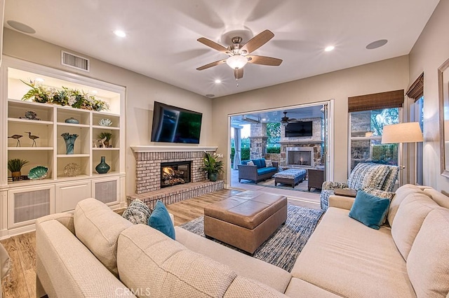 5 Kennedy Ct, Coto De Caza, CA 92679 - living area with a brick fireplace, a ceiling fan, wood finished floors, and recessed lighting