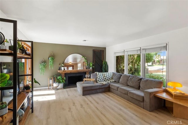 8 Barton Pkwy, Oakdale, CA 95361 - living area with wood finished floors and a fireplace with flush hearth