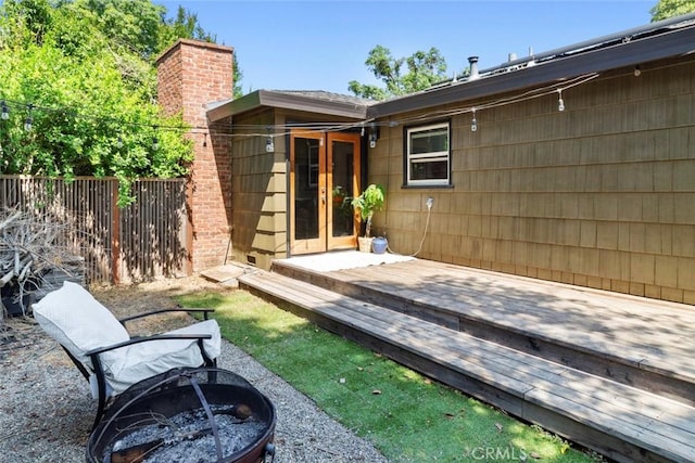8 Barton Pkwy, Oakdale, CA 95361 - back of house with a fire pit, a wooden deck, french doors, and a chimney