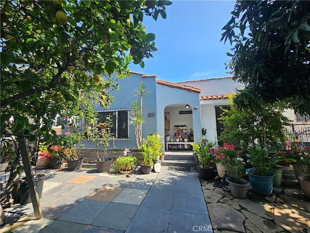 1722 W 60th Pl, Los Angeles, CA 90047 - property entrance featuring stucco siding and a tiled roof