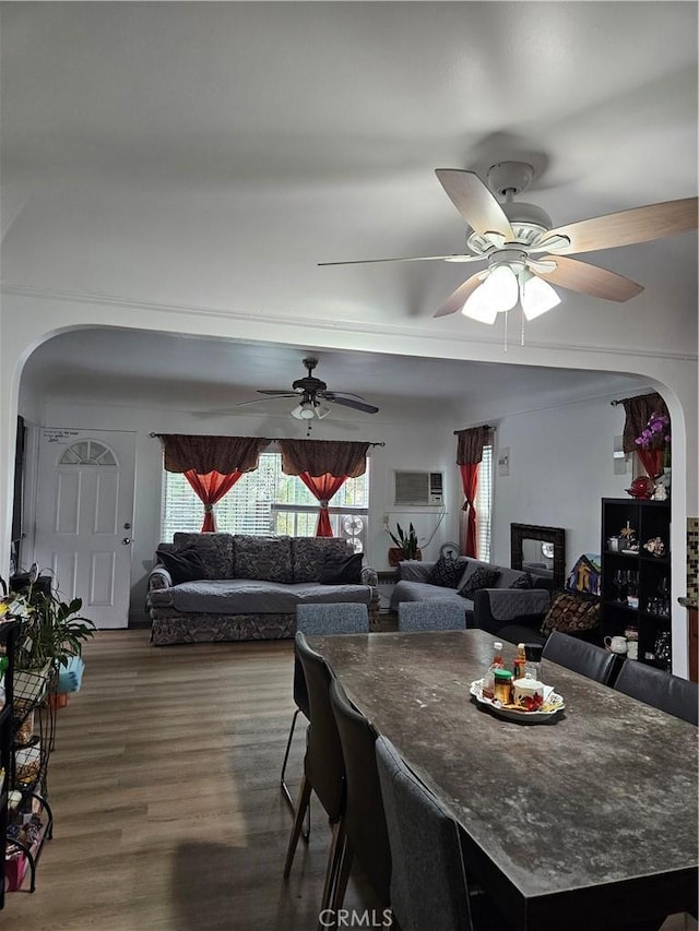 1722 W 60th Pl, Los Angeles, CA 90047 - dining area with arched walkways, wood finished floors, a ceiling fan, and a wall mounted air conditioner