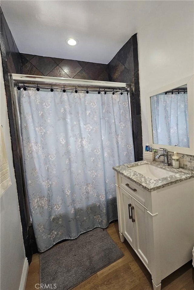 1722 W 60th Pl, Los Angeles, CA 90047 - full bathroom with vanity, a shower with shower curtain, wood finished floors, and recessed lighting