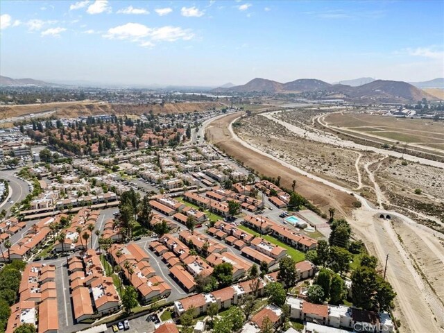 1077 Santo Antonio Dr Unit 54, Colton, CA 92324 - aerial overview of property's location with nearby suburban area and a mountainous background