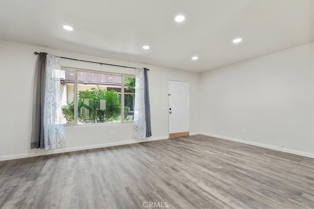 1077 Santo Antonio Dr Unit 54, Colton, CA 92324 - empty room with wood finished floors and recessed lighting
