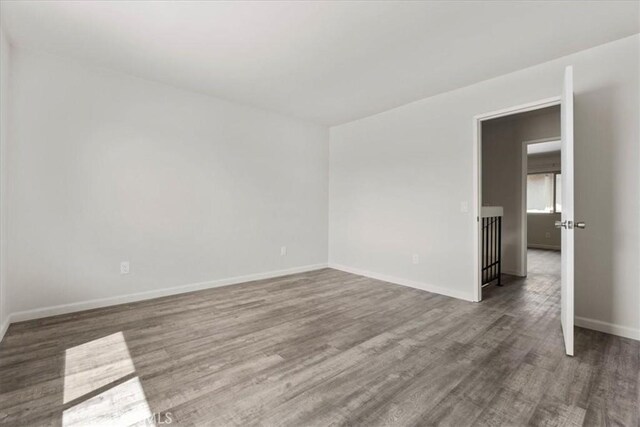 1077 Santo Antonio Dr Unit 54, Colton, CA 92324 - unfurnished room with wood finished floors and baseboards