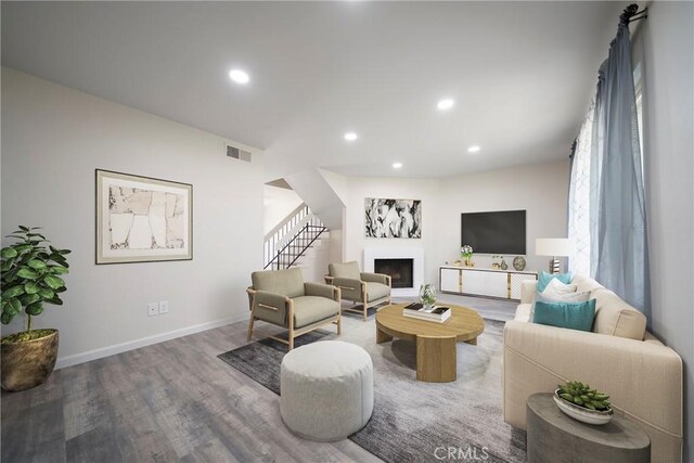 1077 Santo Antonio Dr Unit 54, Colton, CA 92324 - living area featuring wood finished floors, recessed lighting, a fireplace, and stairs