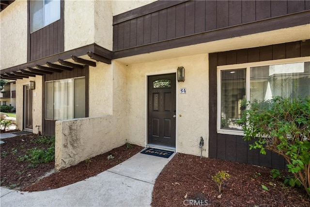 1077 Santo Antonio Dr Unit 54, Colton, CA 92324 - doorway to property featuring stucco siding
