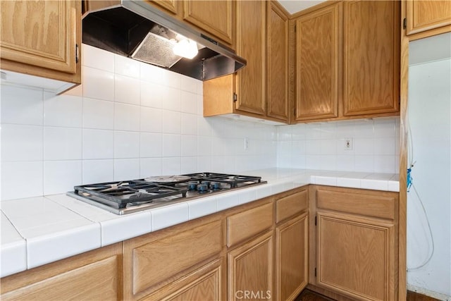1678 Bella Vista Ct, Paso Robles, CA 93446 - kitchen with ventilation hood, tasteful backsplash, tile countertops, and stainless steel gas cooktop