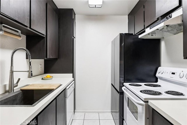 1610 Neil Armstrong St Unit 313, Montebello, CA 90640 - kitchen featuring white appliances, ventilation hood, light countertops, and light tile patterned flooring