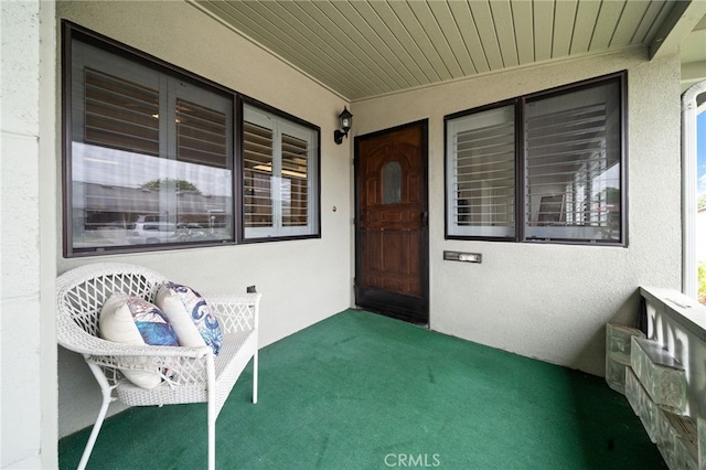 1670 Interlachen Rd Unit 43J, Seal Beach, CA 90740 - doorway to property featuring stucco siding
