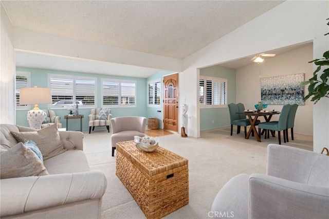 1670 Interlachen Rd Unit 43J, Seal Beach, CA 90740 - living room with carpet, vaulted ceiling, plenty of natural light, and a textured ceiling