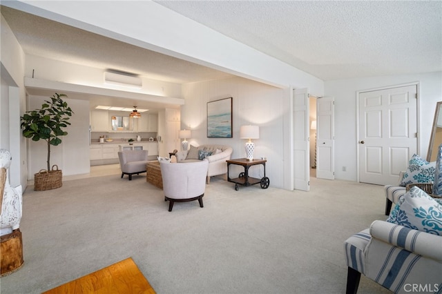 1670 Interlachen Rd Unit 43J, Seal Beach, CA 90740 - living area with light carpet and a textured ceiling