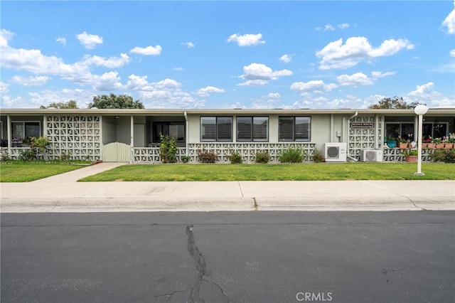 1670 Interlachen Rd Unit 43J, Seal Beach, CA 90740 - view of front of home with a front lawn and covered porch