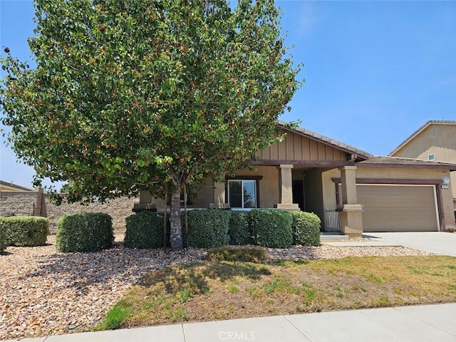 4979 Graphite Creek Rd, Jurupa Valley, CA 91752 - view of front facade with a garage, stucco siding, and driveway
