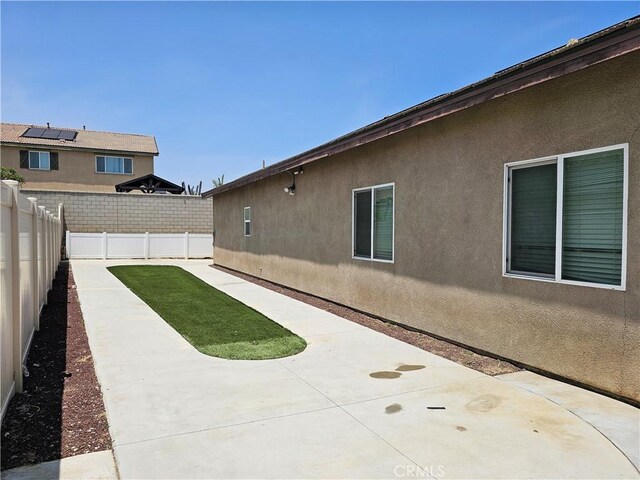 4979 Graphite Creek Rd, Jurupa Valley, CA 91752 - fenced backyard featuring a patio area